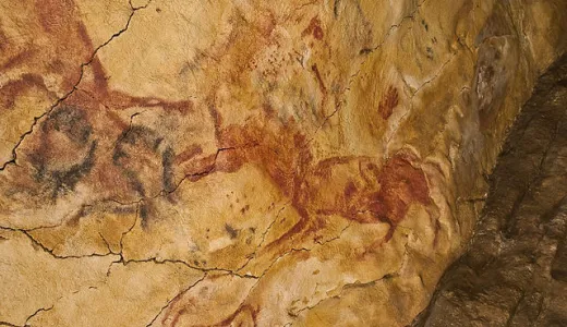 Graffiti dalle grotte di Altamira: impronta di mano e cavallo rosso